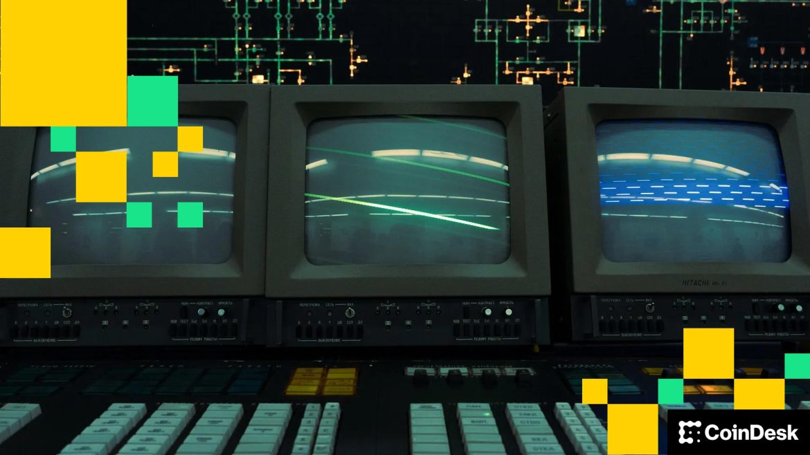 Wall Street signs hang next to a traffic light